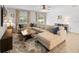 Spacious living room featuring sectional sofa, stylish rug and view to the backyard at 12607 Flatwood Creek Dr, Gibsonton, FL 33534