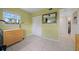 Bedroom with tile floors, window with natural light, closet, and doorway with a hall view at 12900 Vonn Rd # F101, Largo, FL 33774
