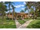 Community pool house with manicured landscaping and sidewalks at 12900 Vonn Rd # F101, Largo, FL 33774