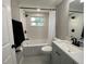 Modern bathroom with white subway tile, updated fixtures, and hexagonal tile flooring at 12907 College Hill Dr, Hudson, FL 34667