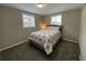Cozy bedroom featuring natural light, neutral walls, and plush carpeting at 12907 College Hill Dr, Hudson, FL 34667