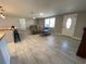 Comfortable living area showcasing tiled floors, recessed lighting, and a view of the front entrance at 12907 College Hill Dr, Hudson, FL 34667