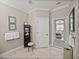 Bathroom boasts neutral colors, tile flooring, and decorative touches; bedroom is accessible through an open door at 13209 Palmilla Cir, Dade City, FL 33525