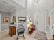 Elegant foyer with high ceilings, decorative lighting, and neutral color palette at 13209 Palmilla Cir, Dade City, FL 33525