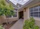 Inviting front entrance with a covered porch and well-maintained landscaping at 13209 Palmilla Cir, Dade City, FL 33525