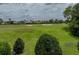 Expansive golf course view with well-maintained greens, sand traps, and surrounding trees at 13209 Palmilla Cir, Dade City, FL 33525