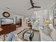 Stylish living area features a sectional sofa, TV, and inviting layout with ample natural light at 13209 Palmilla Cir, Dade City, FL 33525