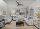 Inviting living room with a comfortable white sectional, decorative art, and a cozy seating arrangement at 13209 Palmilla Cir, Dade City, FL 33525