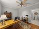 Office with a desk, chair, and a door to the bathroom at 13209 Palmilla Cir, Dade City, FL 33525