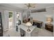 Spacious home office shows multiple desks and balcony access at 13209 Palmilla Cir, Dade City, FL 33525