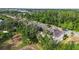 An aerial view of the townhomes surrounded by lush green trees at 13233 Canopy Creek Dr, Tampa, FL 33625