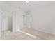 Bright bedroom features neutral walls, carpet, a walk-in closet and attached bathroom at 13233 Canopy Creek Dr, Tampa, FL 33625