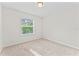 Bedroom features neutral walls, carpet, a ceiling fan, and natural light at 13233 Canopy Creek Dr, Tampa, FL 33625