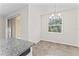 This dining area has tile flooring, a window with blinds, and sliding glass doors that lead to the lanai at 13233 Canopy Creek Dr, Tampa, FL 33625