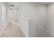 A hallway has neutral-colored walls, white trim and doors, carpet flooring, and recessed lighting at 13233 Canopy Creek Dr, Tampa, FL 33625