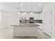 Stylish kitchen boasts granite counters, stainless steel appliances, and white cabinetry at 13233 Canopy Creek Dr, Tampa, FL 33625