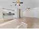 Open-concept living space with kitchen view, featuring tile flooring and natural light throughout at 13233 Canopy Creek Dr, Tampa, FL 33625