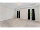 The primary bedroom has carpet flooring, neutral-colored walls, a tray ceiling, and black-out drapes at 13233 Canopy Creek Dr, Tampa, FL 33625