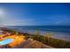 Stunning aerial night view overlooking the pool, beach, and ocean at this beachfront resort at 15000 Gulf Blvd # 602, Madeira Beach, FL 33708