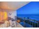 Relax on the balcony with a great view of the ocean and beachside tiki huts at 15000 Gulf Blvd # 602, Madeira Beach, FL 33708