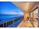 Beautiful ocean view from balcony with seating, perfect for enjoying the serene coastline at twilight at 15000 Gulf Blvd # 602, Madeira Beach, FL 33708