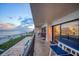 Balcony view overlooking the beach, with outdoor seating and access to the indoors at 15000 Gulf Blvd # 602, Madeira Beach, FL 33708