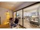 Inviting balcony view into living area with comfortable seating, creating seamless indoor-outdoor flow at 15000 Gulf Blvd # 602, Madeira Beach, FL 33708