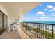 Enjoy the ocean view from this balcony with a table and stools at 15000 Gulf Blvd # 602, Madeira Beach, FL 33708