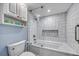 Modern bathroom with glass shower door and white tiled walls at 15000 Gulf Blvd # 602, Madeira Beach, FL 33708
