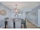 Dining area featuring stylish chairs and a view into the kitchen at 15000 Gulf Blvd # 602, Madeira Beach, FL 33708