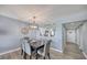 Dining area with elegant chairs and a decorative shell centerpiece at 15000 Gulf Blvd # 602, Madeira Beach, FL 33708