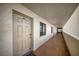Condo hallway with unit number and window looking to the exterior at 15000 Gulf Blvd # 602, Madeira Beach, FL 33708