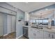 A kitchen with views into the dining and living areas with stainless appliances at 15000 Gulf Blvd # 602, Madeira Beach, FL 33708