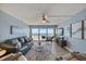 Light and airy living room with ocean view, ceiling fan, and comfortable seating at 15000 Gulf Blvd # 602, Madeira Beach, FL 33708