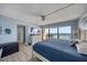 Comfortable bedroom with access to a balcony and ocean views at 15000 Gulf Blvd # 602, Madeira Beach, FL 33708