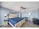 Spacious bedroom with a white bed frame and coastal themed wall art at 15000 Gulf Blvd # 602, Madeira Beach, FL 33708