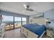 Bright main bedroom with large windows to a balcony providing beautiful ocean views at 15000 Gulf Blvd # 602, Madeira Beach, FL 33708