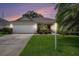 Charming home with a well-manicured lawn, mature landscaping, and a two-car garage at 1744 Brookstone Way, Plant City, FL 33566