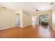 Bright living room with bamboo floors and a ceiling fan, perfect for relaxation at 1744 Brookstone Way, Plant City, FL 33566