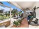 Spacious screened in patio with comfortable seating, a ceiling fan, and backyard views at 1744 Brookstone Way, Plant City, FL 33566
