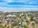 Aerial view of neighborhood homes, road, lake and the Gulf of Mexico at 1810 Maryland Ne Ave, St Petersburg, FL 33703