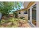 Side yard featuring mature trees and partial fencing, offering a private and shaded retreat at 1810 Maryland Ne Ave, St Petersburg, FL 33703