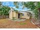 Backyard view featuring a patio area and lush landscaping, offering a private outdoor space at 1810 Maryland Ne Ave, St Petersburg, FL 33703