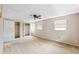 Neutral bedroom featuring two closets, two windows and a ceiling fan with light at 1810 Maryland Ne Ave, St Petersburg, FL 33703