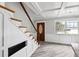 Bright entryway featuring tile floors, coffered ceilings, staircase, and an eye-catching wood door with glass insert at 1810 Maryland Ne Ave, St Petersburg, FL 33703