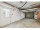 A spacious garage with an entrance door and an overhead door at 1810 Maryland Ne Ave, St Petersburg, FL 33703