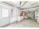 Spacious garage featuring a workbench, ample storage, and a convenient access door to the backyard at 1810 Maryland Ne Ave, St Petersburg, FL 33703