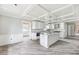 Spacious kitchen featuring coffered ceilings, a kitchen island, and sleek, white cabinetry, great for entertaining at 1810 Maryland Ne Ave, St Petersburg, FL 33703