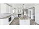 Bright kitchen with coffered ceilings, custom island, sleek, white cabinetry, and stainless steel appliances at 1810 Maryland Ne Ave, St Petersburg, FL 33703