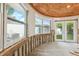Living area with wood ceilings, new flooring, and access to exterior at 1810 Maryland Ne Ave, St Petersburg, FL 33703